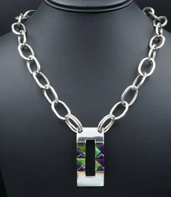 Valentin A Sterling Silver Inlay Pendant Necklace Carico Turquoise 20" Z NS952: This chunky statement necklace features an open squared modernist pendant inlaid with lime green Carico Lake turquoise and deep purple sugilite. The stones are precisely cut into triangular shapes to 