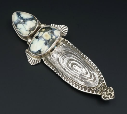 David Troutman Sterling Silver Variquoise Turquoise Brooch 3.3" OS604: This chunky artisan brooch features two beautiful carved turquoise slabs bezel set in sterling silver. The stones create the hilt of this dagger shaped piece with the sterling silver "blade" displayin