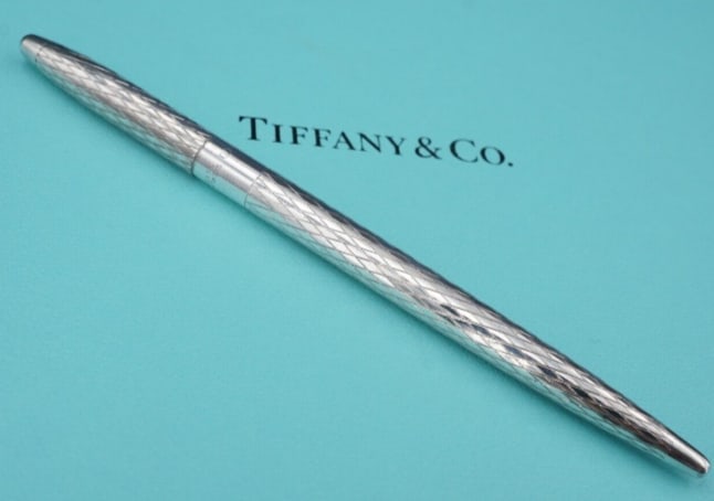 Tiffany & Co. Sterling Silver Ball Point Pen Ornate Detail 4.5" No Cart M1814: This beautiful ball point pen from Tiffany & Co. features a classic polished look with a deep engraved diamond design. Does not arrive with cartridge. A great addition to any collection. Metal Type: S