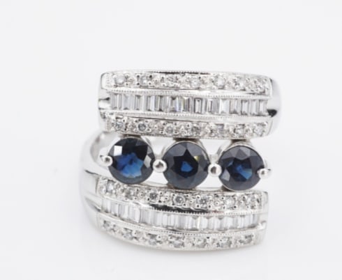 18k White Gold Natural Sapphire Diamond Bypass Ring Sz 7.5 Vintage Unique RG4705: This vintage cocktail ring features three natural sapphires prong-set at center representing the past, present, and future, flanked with channel-set sparkling diamond accents. The diamond shoulders sw