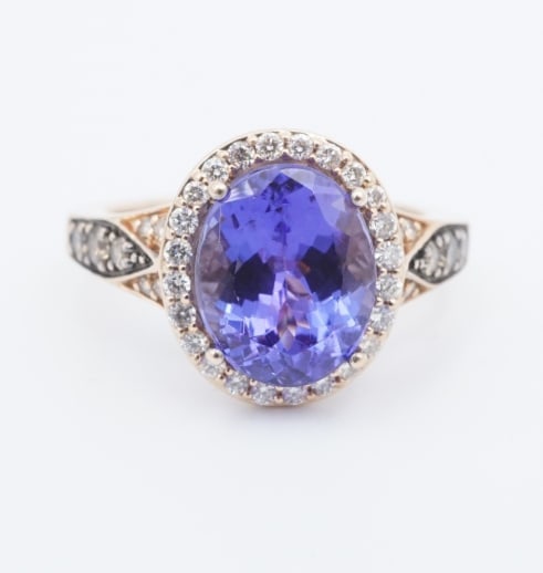 LeVian 14k Tanzanite Diamond Ring Strawberry Gold Cocktail Natural Sz 5.5 RG5071: This beautiful designer Le Vian ring features a stunning oval-cut "blueberry" tanzanite set atop a slim rose gold cathedral setting embellished with a stylish halo of round diamonds. "Chocolate" diamo