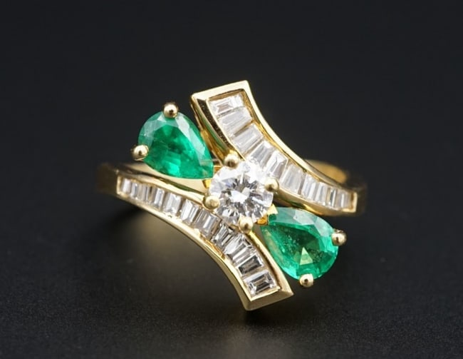 Vintage 14k Natural 1.5ct Emerald Diamond Bypass Ring Natural Size 6.75 RG4797: This vintage cocktail ring features a natural diamond prong-set at the center of a 14k yellow gold bypass design embellished with rows of channel-set sparkling diamond accents. Each shoulder is adorne