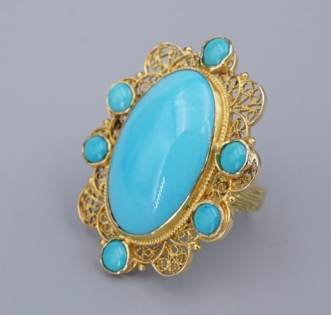 18k Yellow Gold Turquoise Ring Size 7.25 Cocktail Designer RG4828: This modern designer ring features a stunning filigree design swirling around turquoise cabochons bezel set in luxe 18k yellow gold. This ring is a one-of-a-kind ring, perfectly on trend. Metal Type: 