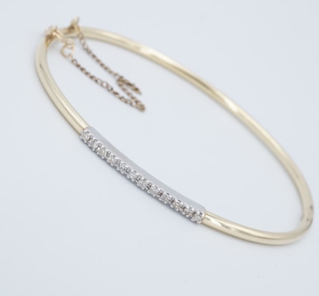 14k Gold Diamond Hinged Bangle Bracelet 2 Tone White Yellow 7" BG1115: This gorgeous hinged bangle has bright white diamonds set across the face in white gold. The bracelet hinges open and fastens securely closed with an insert clasp with additional safety chain. Crafted