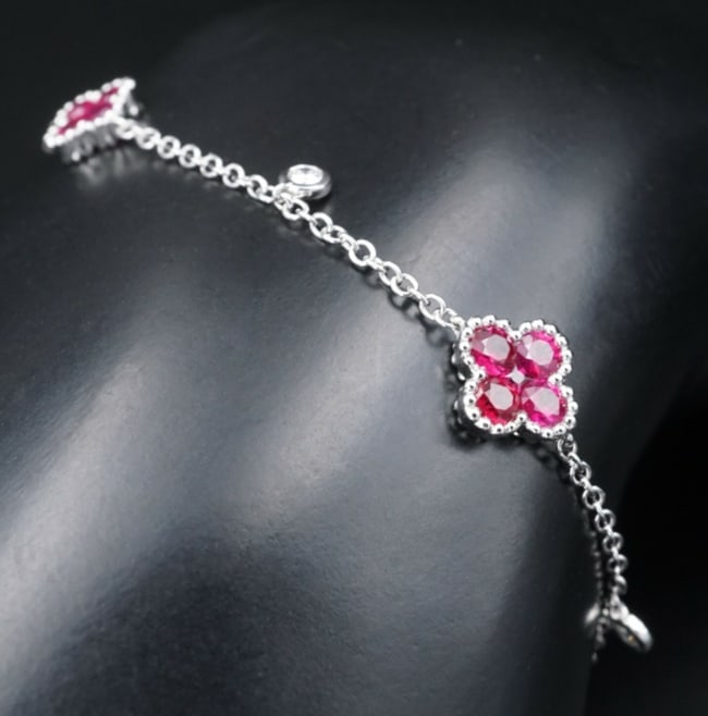 Ruby Diamond Station Bracelet Quatrefoil 18k White Gold 1.75ct 7" BG640: This stunning bracelet features vivid red natural rubies in a quatrefoil design, with sparkling diamond dangle accents. An amazing designer creation with the attributes of the finest design houses. A 