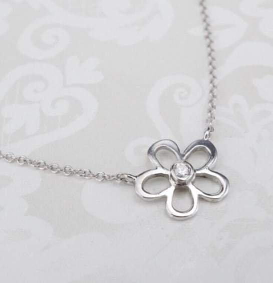 14k Flower Pendant Necklace White Gold Natural Diamond Solitaire 14.5" NG1632: This gorgeous necklace centers on a natural white diamond bezel-set in an openwork flower pendant set in solid 14k white gold. Suspended elegantly from a 14k white gold cable chain, this piece is a mo