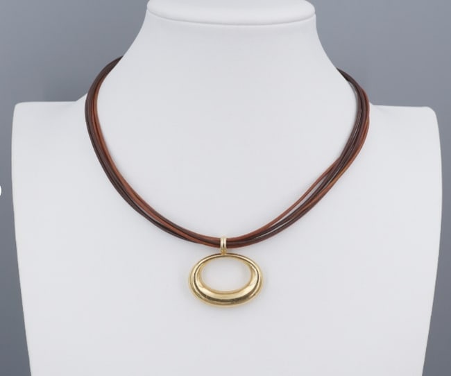 14k Multi Strand Open Circle Pendant Necklace 14k Yellow Gold JCM 17" NG1837: This beautiful necklace from designer JCM features a large open oval pendant suspended on a stylish black and brown multi strand necklace, adding to the allure! This beautiful necklace perfect for any