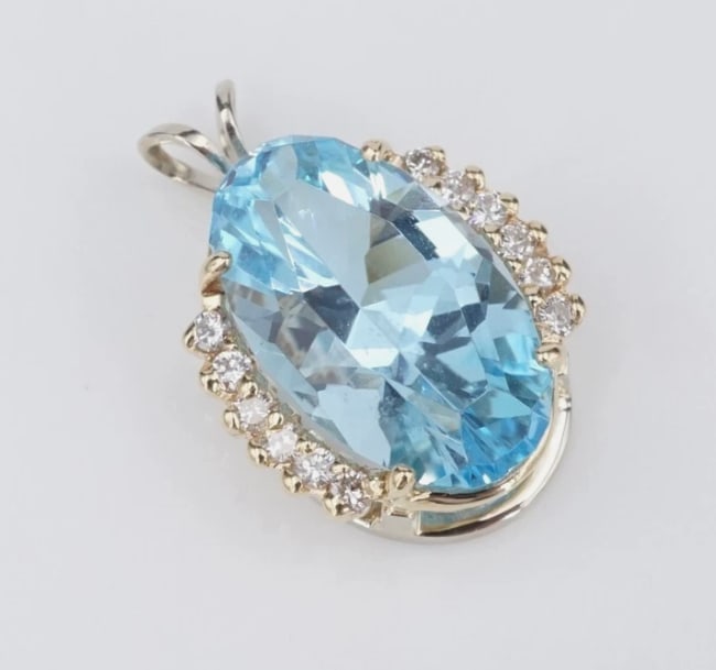 14k Blue Topaz Diamond Pendant Yellow Gold 1" Vintage Oval PG2036: This vintage pendant features a vivid oval cut blue topaz prong set in luxe 14k yellow gold, flanked by columns of sparkling diamonds. Classic and elegant, this pendant will pair beautifully with a ch