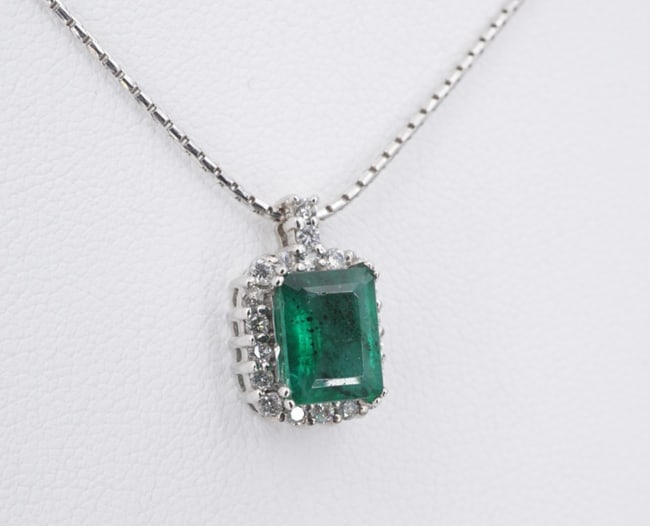 14k Gold Natural Emerald Diamond Halo Pendant Necklace 18" NG1848: This lovely necklace features a cluster of vivid green emerald framed by a halo of natural, round cut diamonds. Additional diamonds accent the bale, adding even more sparkle! Suspended from an 14k whi