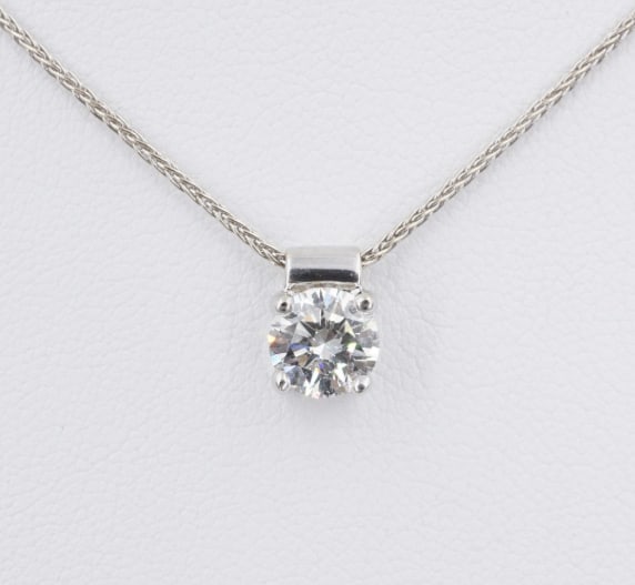 18k White Gold Diamond Pendant Necklace 26" Bolo Signed Designer NG1838: This beautiful necklace features a prominent round brilliant diamond in a sleek modern basket with slide bale, moving freely on a supple wheat chain. the chain is finished with a bolo slide fastener a