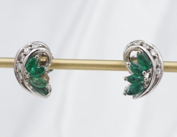 Vintage 14k Natural Emerald Diamond Stud Earrings White Gold Marquise EG2359: This beautiful pair of 14k white gold earrings feature marquis cut, prong set emeralds in an intricate, crescent shaped design decorated with diamonds at the crown. The earrings fasten securely with 1