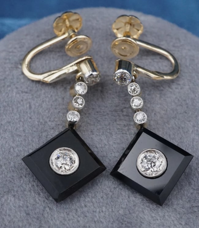 Antique 14k 18k Diamond Onyx Dangle Earrings Yellow Gold Victorian 1.1" EG2396: These beautiful antique earrings each feature two beautiful Old Mine cut diamonds framed by square onyx panels on the bias, suspended from an articulated line of bezel-set diamonds. The diamonds are s