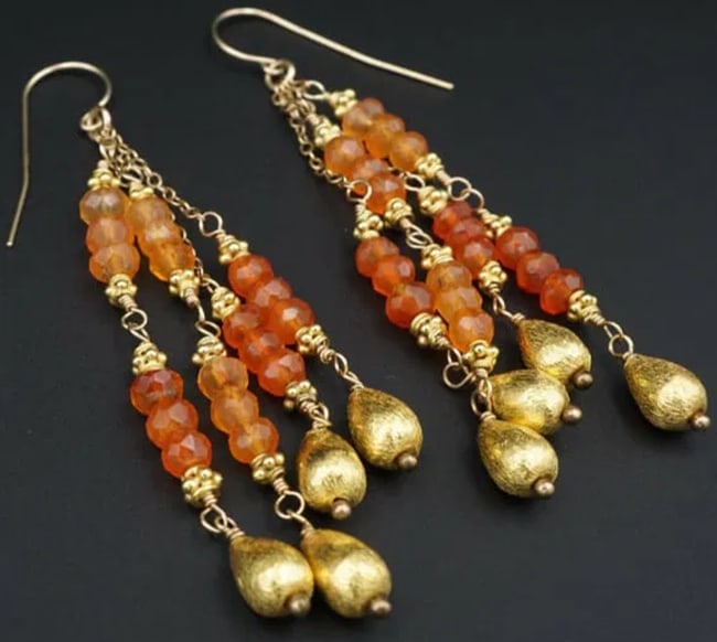 22k Carnelian Dangle Earrings Yellow Gold Bead Drop 3.2" EG1637: This beautiful pair of dangle earrings features round faceted beads of warm orange carnelian gemstones interspersed with 22k yellow gold beads. Earrings fasten securely with 14k hooks. This lovely pai