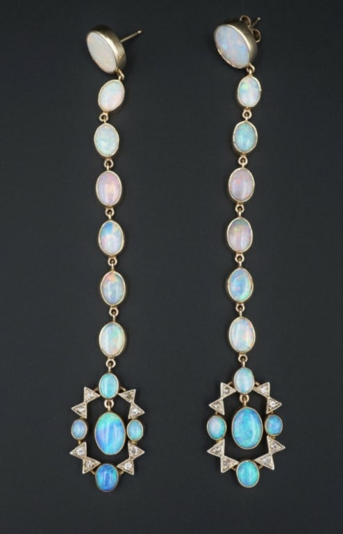 Antique Victorian 14k Gold Diamond Opal Earrings 10 ctw Dusters 4" EG1644: This stunning pair of antique earrings feature 24 cabochons of natural opals, each ringed with a 14k yellow gold bezel, leaving an open back to allow light through each stone. The incredible full-spec