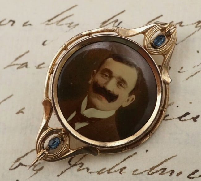 Victorian Miniature Portrait Pin Brooch Amazing Mustache 8k Gold 1.6" OG493: This beautiful antique brooch features a portrait of a man with a prominent mustache bezel set in an 8k yellow gold construction with blue crystal accents. The pin and mechanism are all original. A go