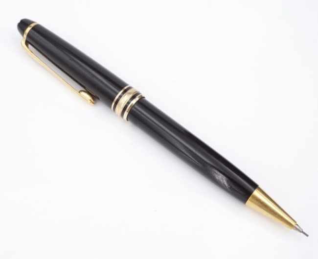 Montblanc Meisterstuck 165 Mechanical Pencil Germany Gold Tone 0.7mm Resin M1974: This incredible Montblanc mechanical pencil is from the Meisterstuck collection, meaning masterpiece. The cap and barrel are crafted of black resin inlaid with the iconic "Montblanc Meisterstuck" embl