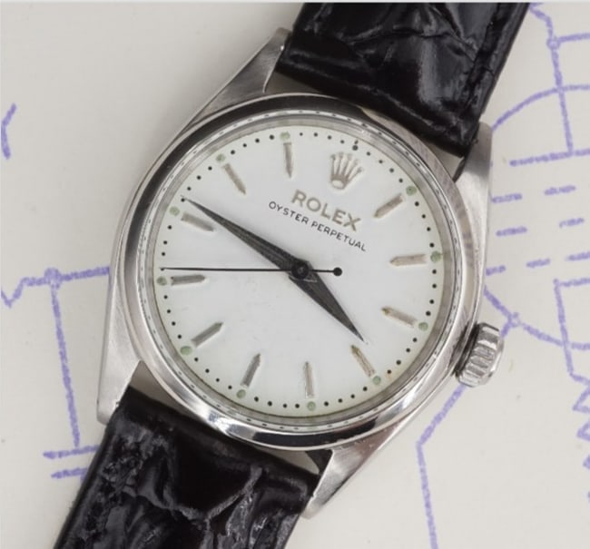 1959 Rolex Oyster Perpetual Watch Leather Strap 31mm Automatic 6548 W1145: This beautiful early Rolex Oyster Perpetual watch features a round case with a black leather strap. Circa 1959. Smooth bezel with baton markers. Newly serviced with one year warranty. Metal Type: Stai