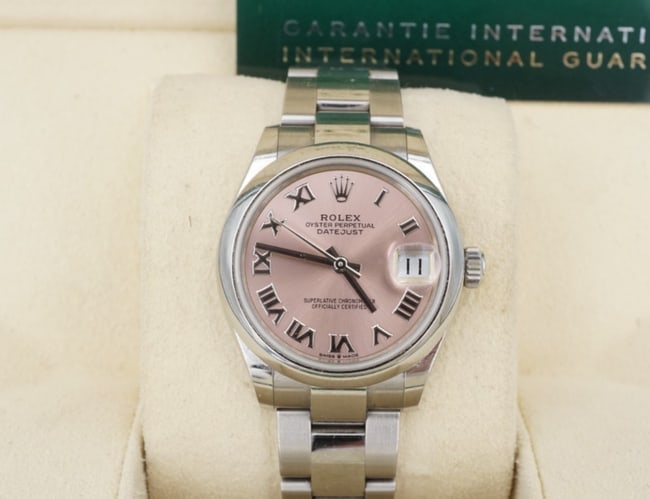 2022 Ladies DateJust Rolex 278240 SS Warranty 31mm Pink Dial Box Card W1324: Guaranteed authentic Ladies Rolex Datejust model 278240. This classic watch features a solid stainless-steel case, domed bezel, oyster link bracelet, sapphire crystal with date bubble, and pink dial w