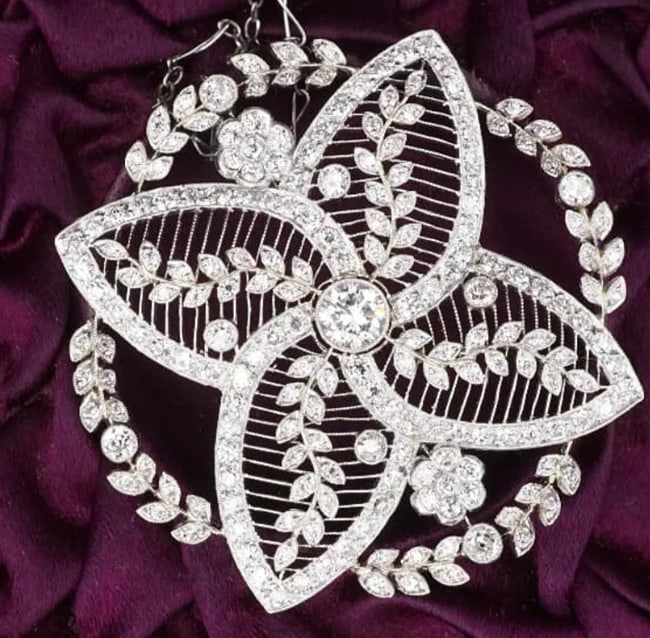 Antique Belle Epoque Platinum Diamond Floral Filigree Pendant Necklace NG1340: This elegant necklace features a large sparkling floral pendant encrusted with diamonds set on a delicate fancy link chain. The perfect filigree detail make this a true Edwardian piece. Two petite flo