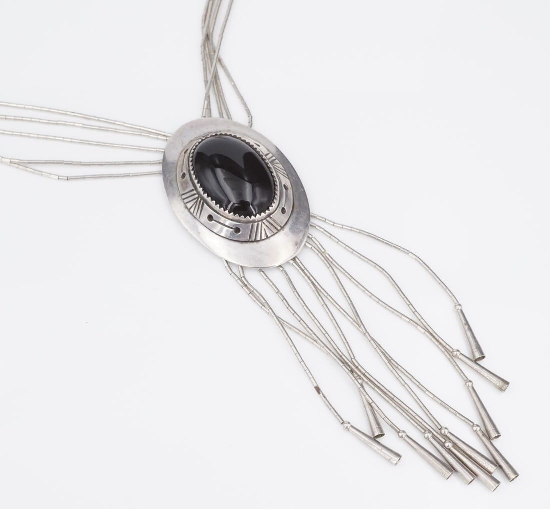 Navajo Alice McShirley Sterling Silver Onyx Fringe Pendant Necklace 23": This Navajo pendant necklace by artist Alice McShirley features a large oval onyx cabochon framed in decorated sterling silver. Suspended from a multi-strand liquid silver chain, this piece is perfect