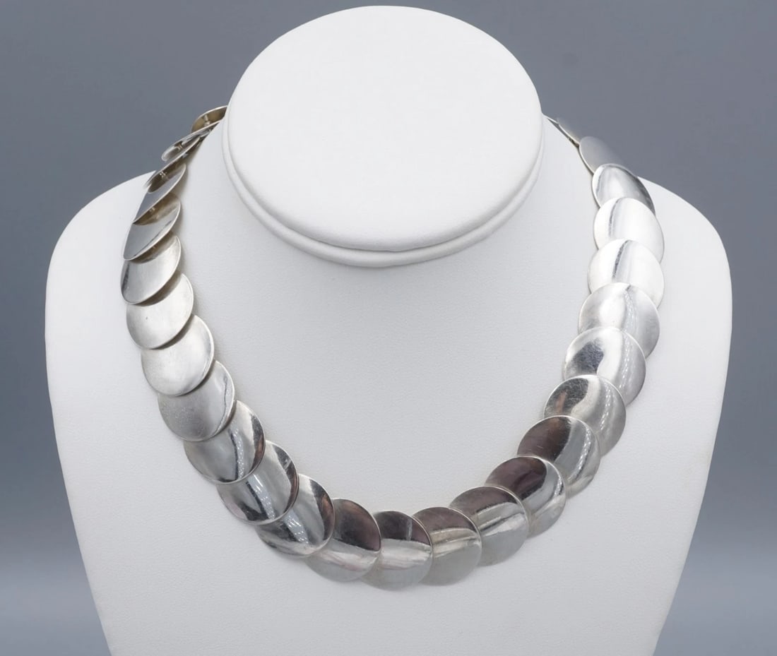 Navajo Yellowhorse Necklace Sterling Silver 24" Saucer Station Necklace: This unique piece features a strand of saucer shaped stations, a secures with a sturdy hook and eye clasp, Designed by Navajo artist Steve Yellowhorse with S.E. and crafted of sterling silver. A perfe
