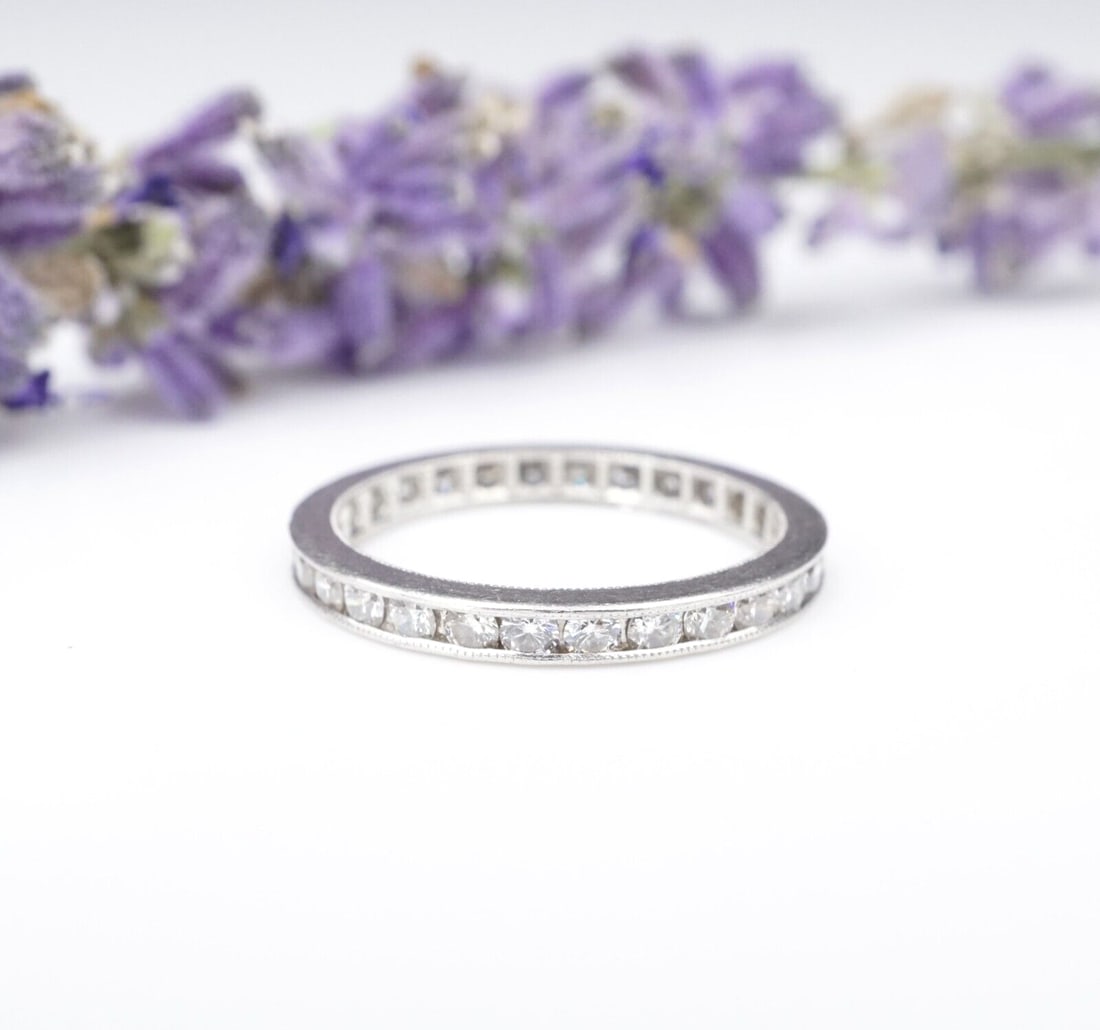 Platinum Eternity Band Diamond 1 carat Anniversary Wedding Ring Size 5: This beautiful band ring features 28 natural diamonds channel-set around the entirety of the ring, with worn milgrain and etched details along the sides. The high-quality diamonds have the perfect amo