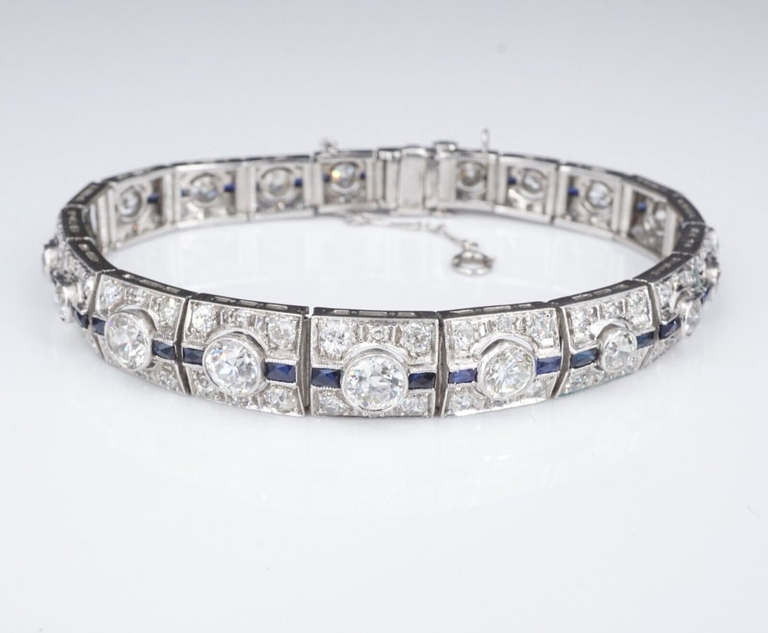 Art Deco Sapphire Diamond Bracelet Platinum Antique 9 carats 7.25": This gorgeous bracelet is a true vintage Art Deco treasure! Each panel features a prominent bezel-set round diamond accented by diamonds and a line of brilliant blue sapphires, all set in solid platin