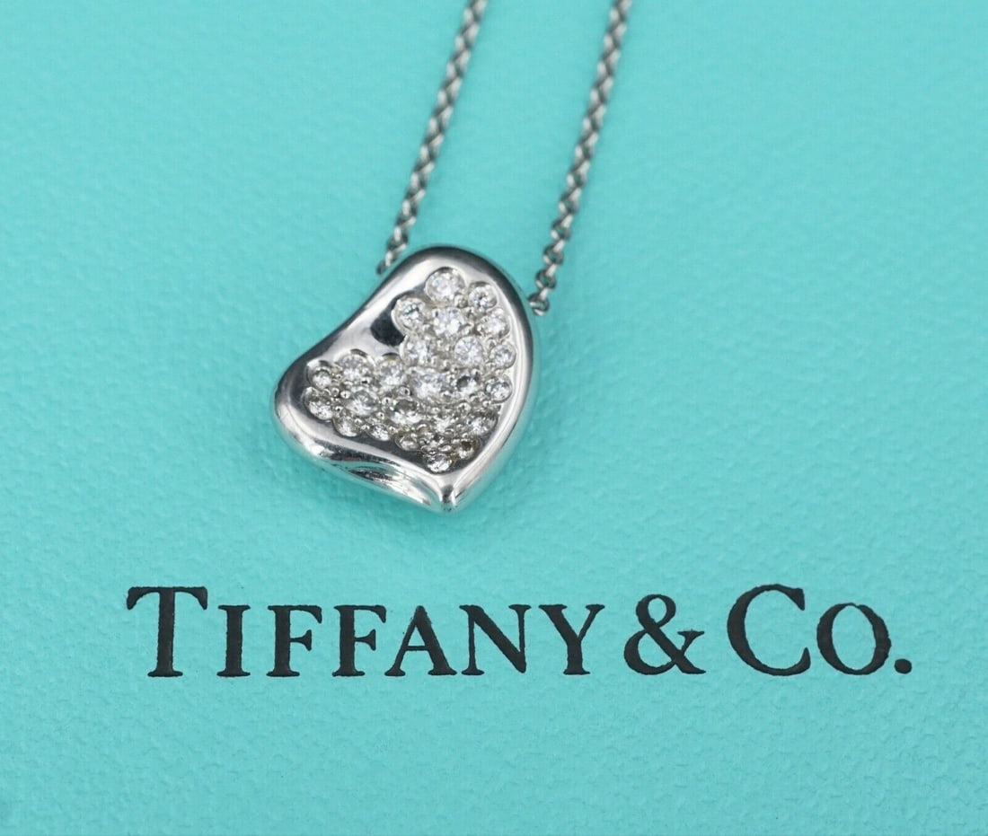 Tiffany Diamond Peretti Full Heart Necklace Pave Platinum 16" Box: This rare necklace features heart set with a field of sparkling diamonds set inside the polished frame. Elegant and alluring, this sweet piece is amazing on its own or layered with your other favorite