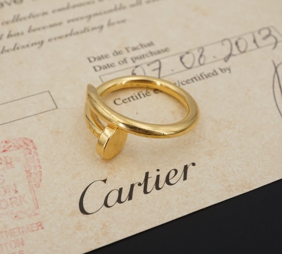 Cartier 18k Yellow Gold Nail Ring Sz 58 Classic Juste un Clou Box & Cert: From the "Juste un Clou" collection, this classic ring is crafted of solid 18k yellow gold. New closure system. Described by Cartier, "Conceived in '70s New York, the Juste un Clou collection reflects