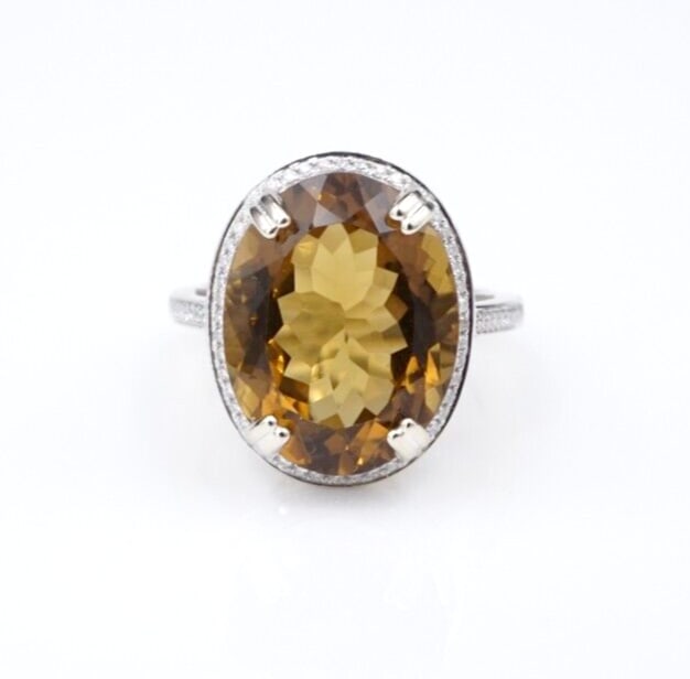 14k White Gold Citrine Diamond Halo Cocktail Ring 8ctw Natural Size 6.5 RG4534: This stunning ring features a golden-brown, ovular-cut citrine surrounded by a halo of bright white diamonds set atop a luxe 14k white gold band with additional diamonds cascading down each shoulder. 