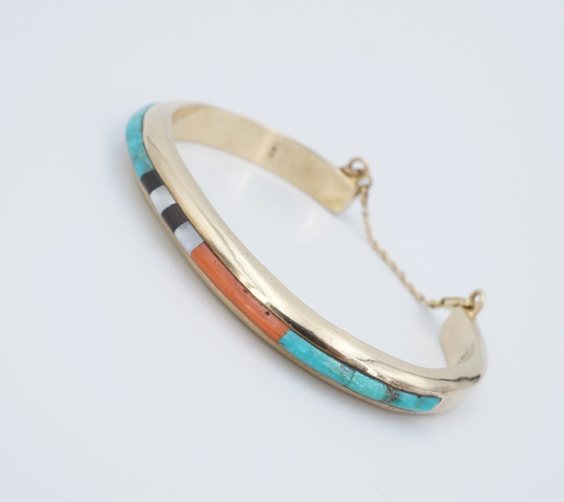 Navajo Jimmy King Jr 14k Yellow Gold Coral Turquoise Cuff Bracelet 6.25" BG1071: This lovely cuff bracelet features a linear turquoise stonework set in solid yellow gold. The handcrafted gold work is alluring patterns of mix stones. This one-of-a-kind statement piece will be a gre