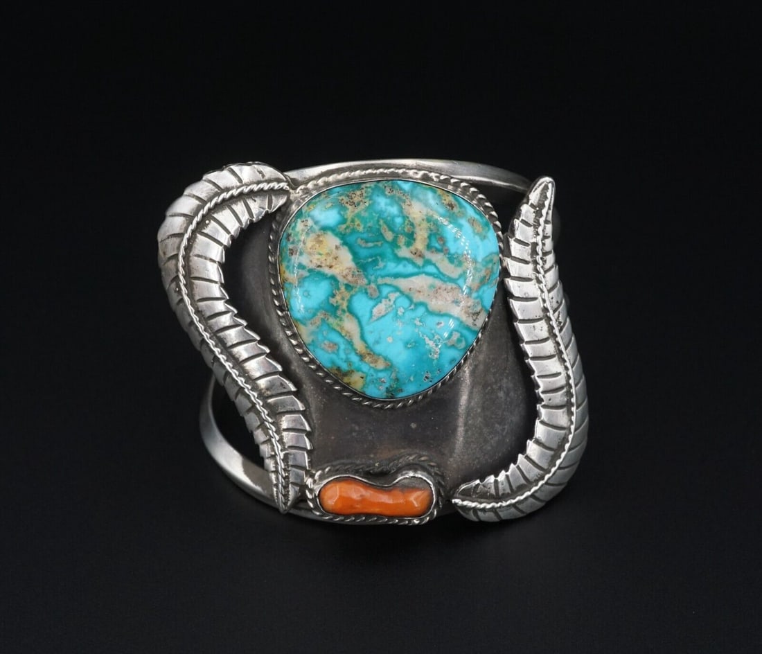 Vintage Tigua Pueblo Sterling Silver Kingman Turquoise Cuff Bracelet 6" BS2755: This lovely cuff bracelet features a beautiful natural Kingman turquoise and coral, bezel-set in solid sterling silver. The handcrafted silver work is alluring with rope and leaf patterns weaving arou