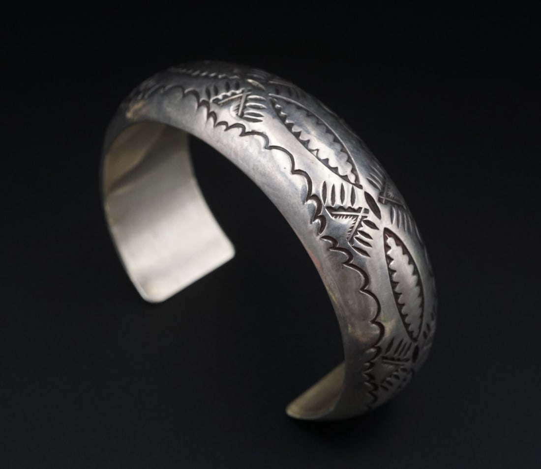 Navajo Sterling Silver Cuff Bracelet Hand Stamped 6.5" Southwest BS3002: This chunky bracelet is crafted of solid sterling silver and features hand stamped detailing on the face. Sleek and simple, this piece is great worn on its own or added to your favorite stack! Metal T