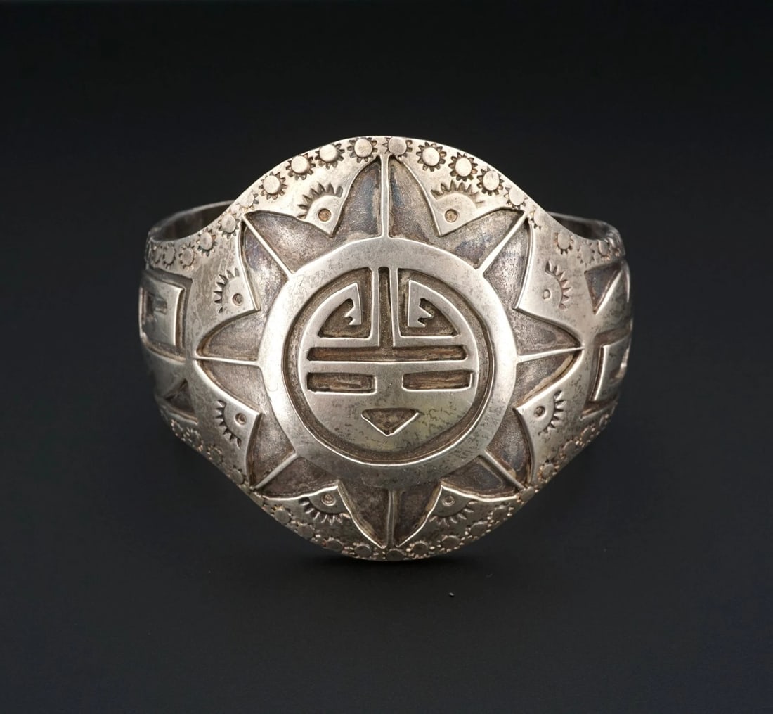 Vintage Wide Sunface Overlay Cuff Bracelet Sterling Silver 6.5" Signed BS3132: This unique Southwestern bracelet centers on an wide ornate Sunface overlay design in the center of a chunky sterling silver cuff with beautiful hand-stamped accents throughout. Complete with addition