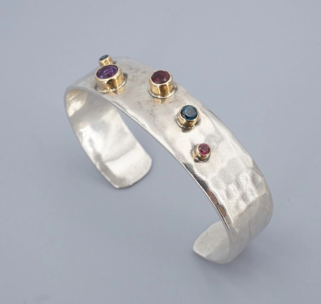 Southwestern 2-Tone Multi-Gemstone Cuff Bracelet 14k Sterling Silver 6.5" BS3256: This bold Southwestern design features a wide sterling silver cuff embellished with a cluster of mixed gems bezel set in 14k yellow gold. This unique bracelet is an eye-catching piece worthy of displa