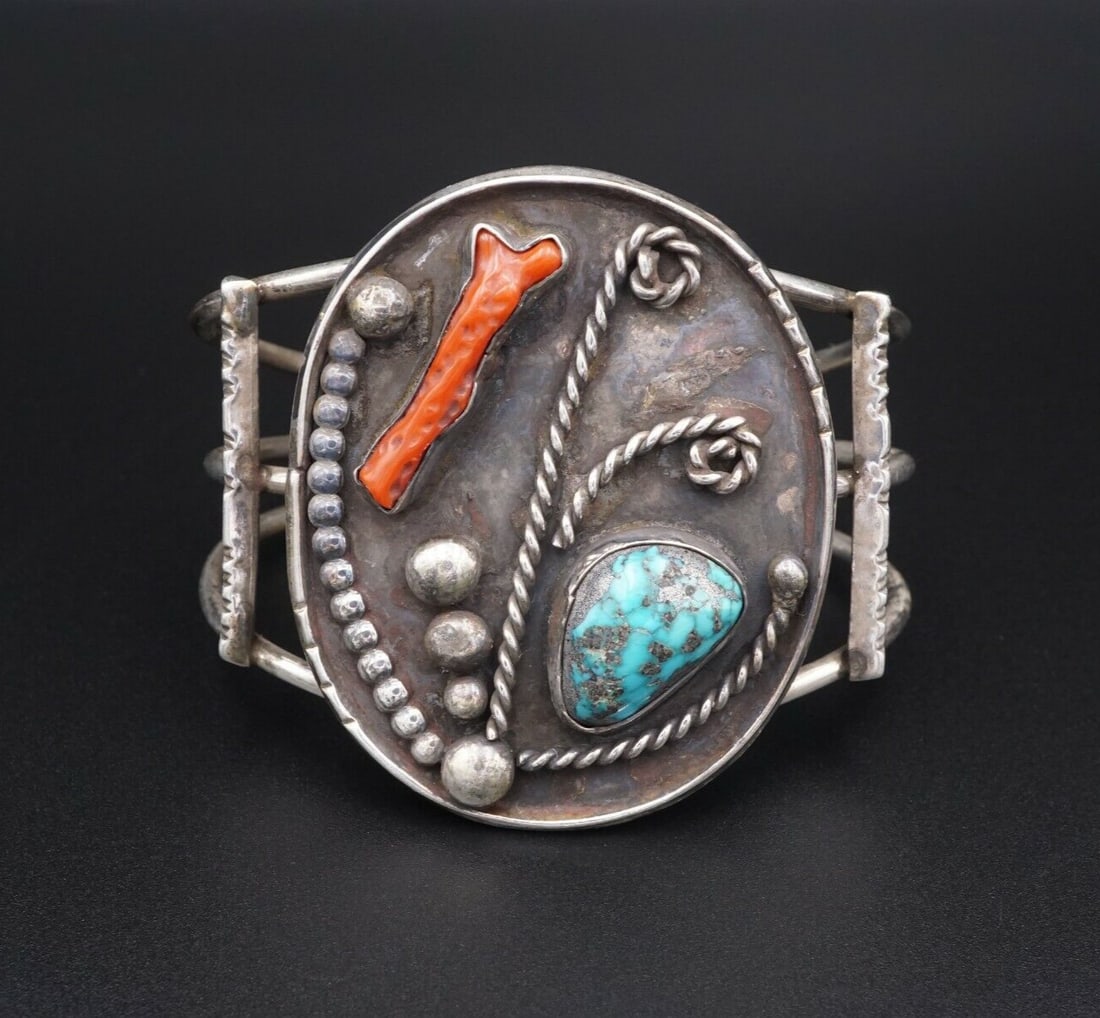 Vintage Navajo Turquoise Coral Cuff Bracelet Sterling Silver Rope 6.75" BS2026: This lovely cuff bracelet features a beautiful natural turquoise and coral, bezel-set in solid sterling silver. The handcrafted silver work is alluring with rope and beaded patterns weaving between an