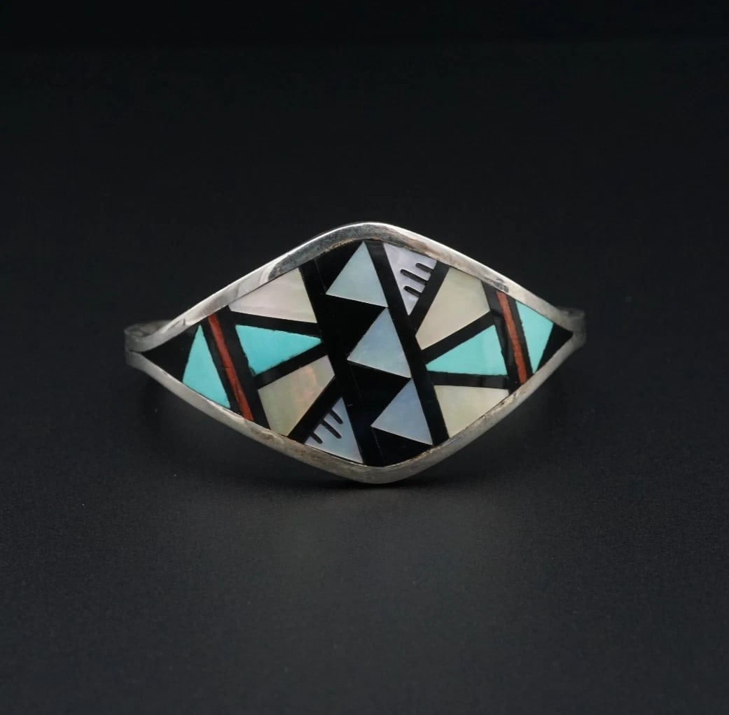 Southwestern Gemstone Mosaic Inlay Sterling Silver Cuff Bracelet 6" Sue BS3123: This unique Southwestern cuff features a geometric inlay of turquoise, coral, onyx, and mother of pearl set flush on the entire face of this tapered cuff bracelet. A beautiful pop of color, great on i