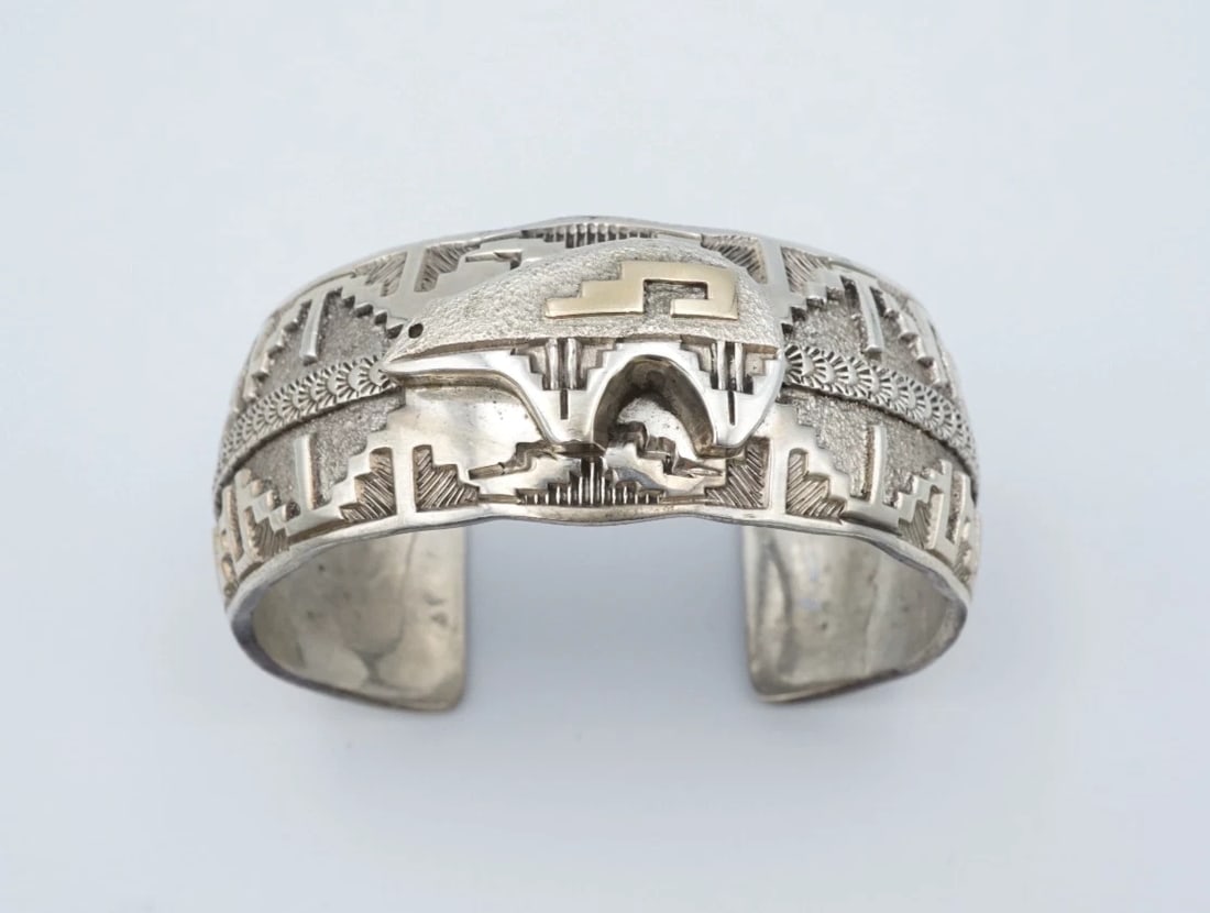 Navajo Jefferson Brown Sterling Silver 14k Gold Bear Cuff Bracelet 6.5" BS3177: This elegant cuff bracelet is crafted and signed by Navajo artisan Jefferson Brown. Featuring a raised medicine bear with yellow gold accents. With geometric designs and hand tooled stamp-work this ve