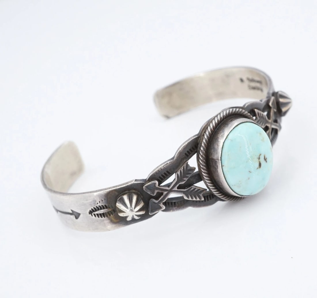 Bobby Johnson Turquoise Cuff Bracelet Sterling Silver 6.25" Navajo Signed BS3185: This classic cuff bracelet from Navajo artisan Don Johnson features a large, ovular turquoise cabochon bezel-set atop a chunky sterling silver cuff bracelet with a split-shank design. The bracelet is 