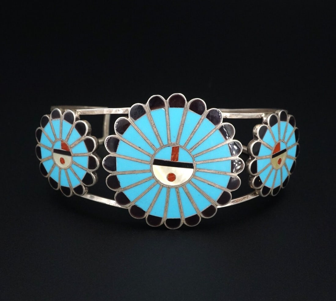 Zuni Sunface Cuff Bracelet Sterling Turquoise Inlay Adrian Wallace 7.25" BS2829: This beautiful vintage cuff bracelet has three sun faces inlaid with sections of turquoise, coral, onyx and mother of pearl. The split shank design gives the cuff a delicate feel with a statement look