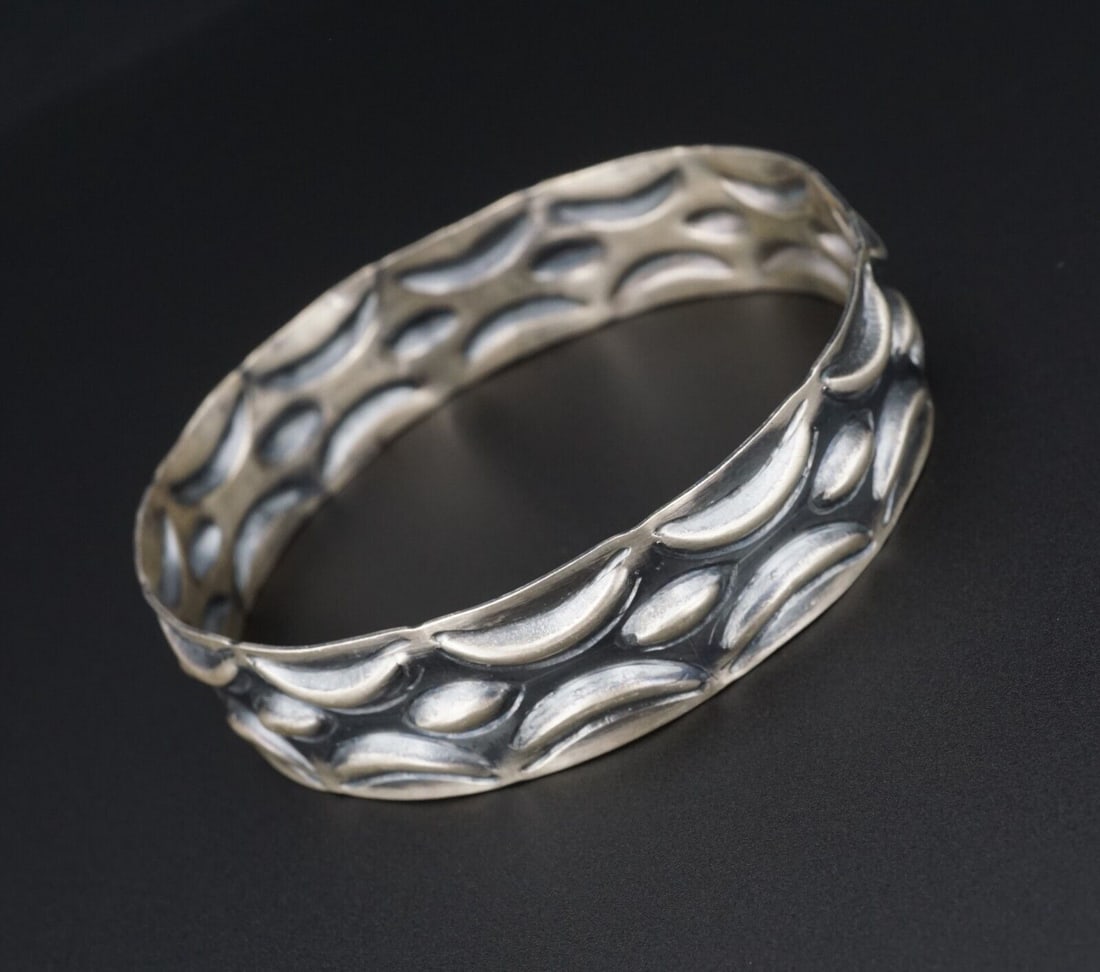 Navajo Sterling Silver Bangle Bracelet Chunky 8.25" T. Yazzie Tribal BS2805: This handmade sterling silver bangle displays beautiful deep hand-stamped detailing around the entire cuff. Crafted of solid sterling silver with a substantial 2/3" width, this statement piece is grea