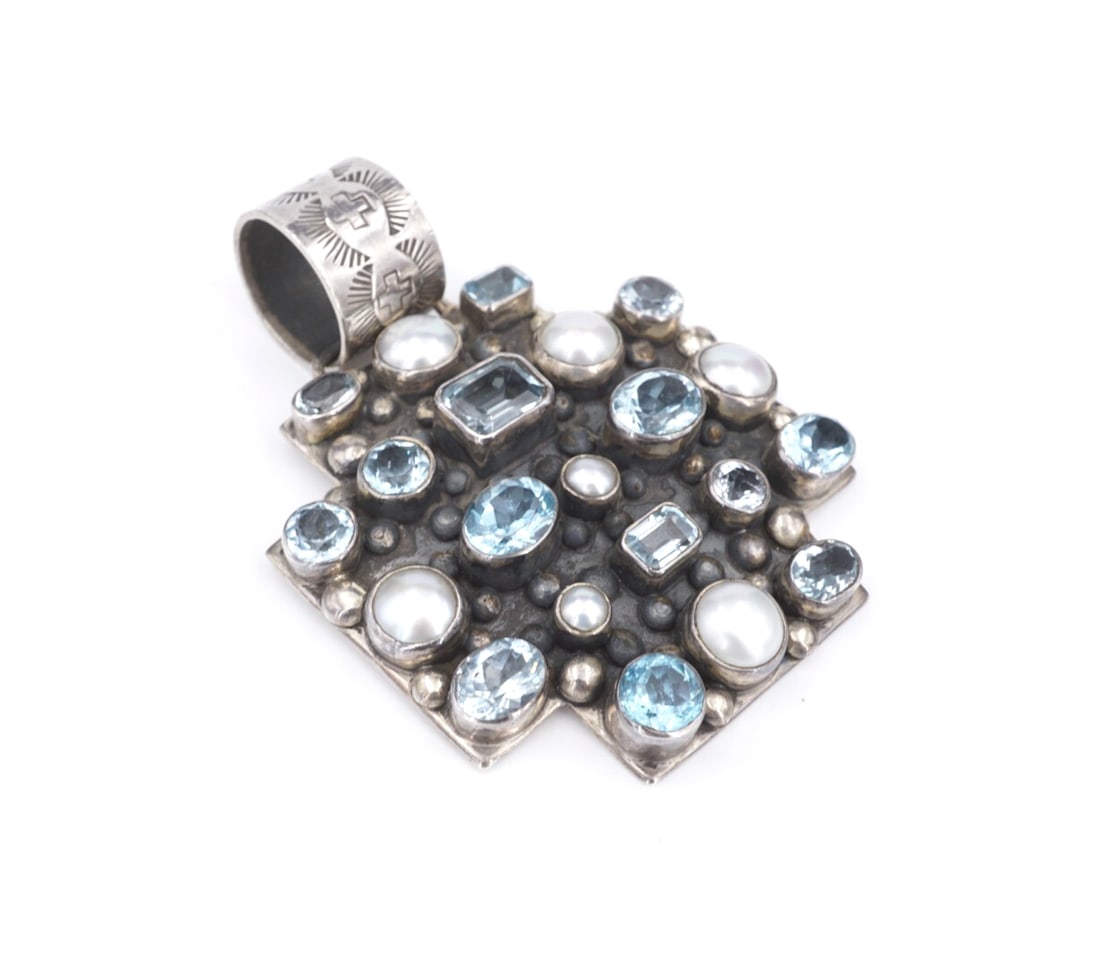Sterling Silver Blue Topaz Pearl Cross Pendant 3" Bead Navajo Signed DMD PS2227: This beautiful pendant features a large, sterling silver cross pendant adorned with bezel set blue topaz and pearl accents of different cuts and sizes. With bead accents and a hand stamped design on t