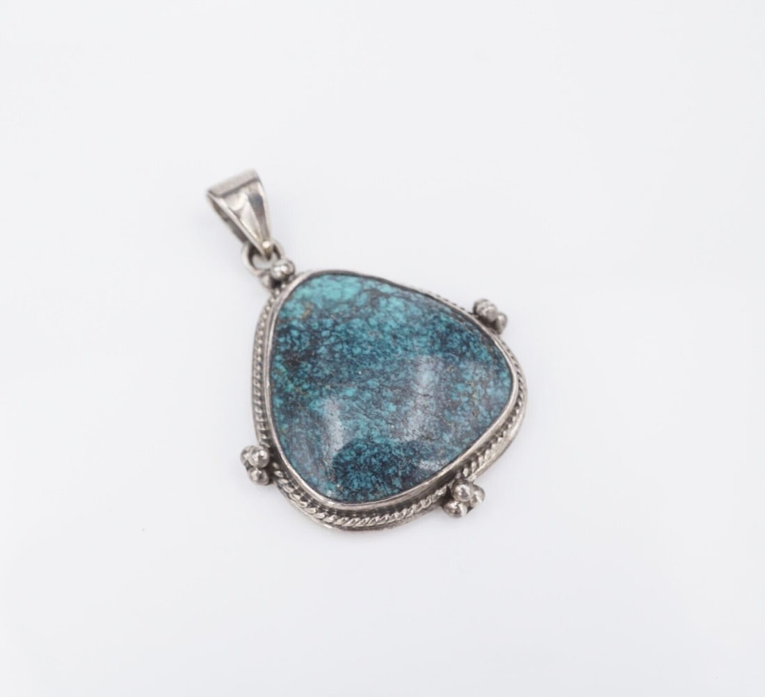 Sterling Silver Spiderweb Turquoise Pendant Statement Southwestern 1.75" PS2115: This chunky artisan pendant features a beautiful turquoise cabochon with a rope frame with bead accents. All crafted of solid sterling silver. The gorgeous teal of the stone and the darker natural mat