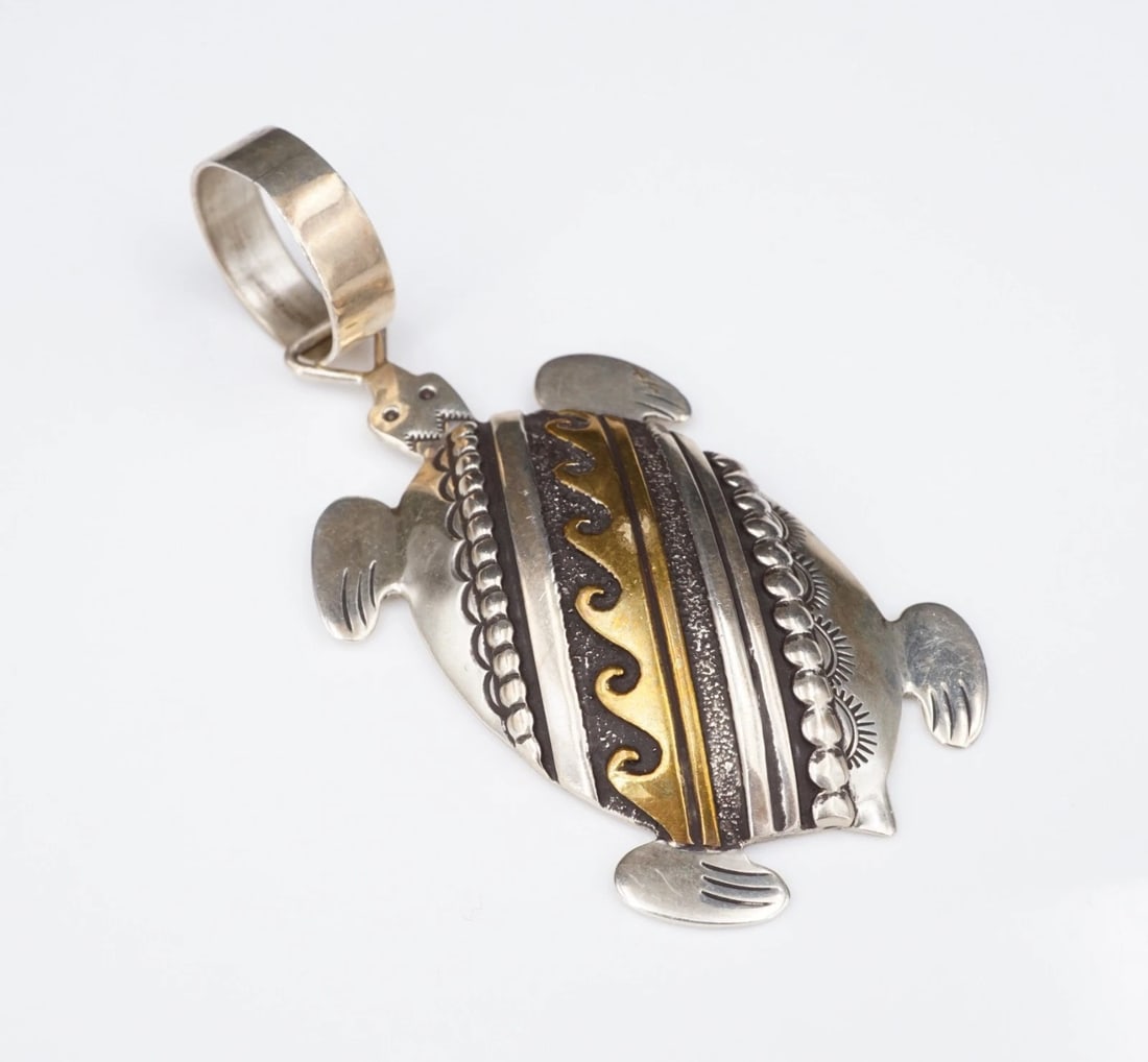 Navajo 2-Tone Sea Turtle Pendant Overlay Sterling Silver 3" Thomas Singer PS2342: This beautiful pendant from Navajo artisan Thomas Singer features an intricate, 3D turtle pendant embellished with a gold tone wave overlay, bead accents and beautiful hand stamped designs. The large 