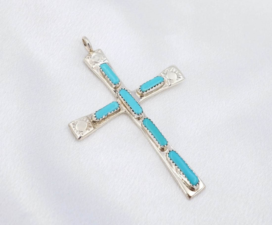 Cecilia Iule Turquoise Cross Pendant Sterling Silver Stamped 2" Zuni PS2297: This classic pendant from Zuni artisan Cecilia Iule features a large sterling silver cross pendant embellished with elongated turquoise cabochons set in sawtooth bezels on each arm. Complete with hand