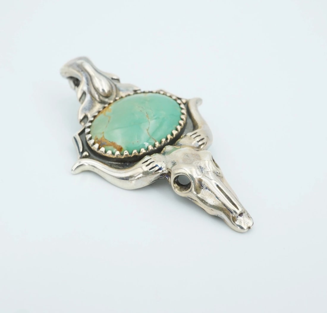 American West Turquoise Cow Skull Pendant Enhancer 2.4" Carolyn Pollack PS2346: This beautiful enhancer pendant from American West features a large turquoise cabochon bezel set in solid sterling silver with a 3D longhorn motif at the base. Complete with an ornate enhancer bale, t