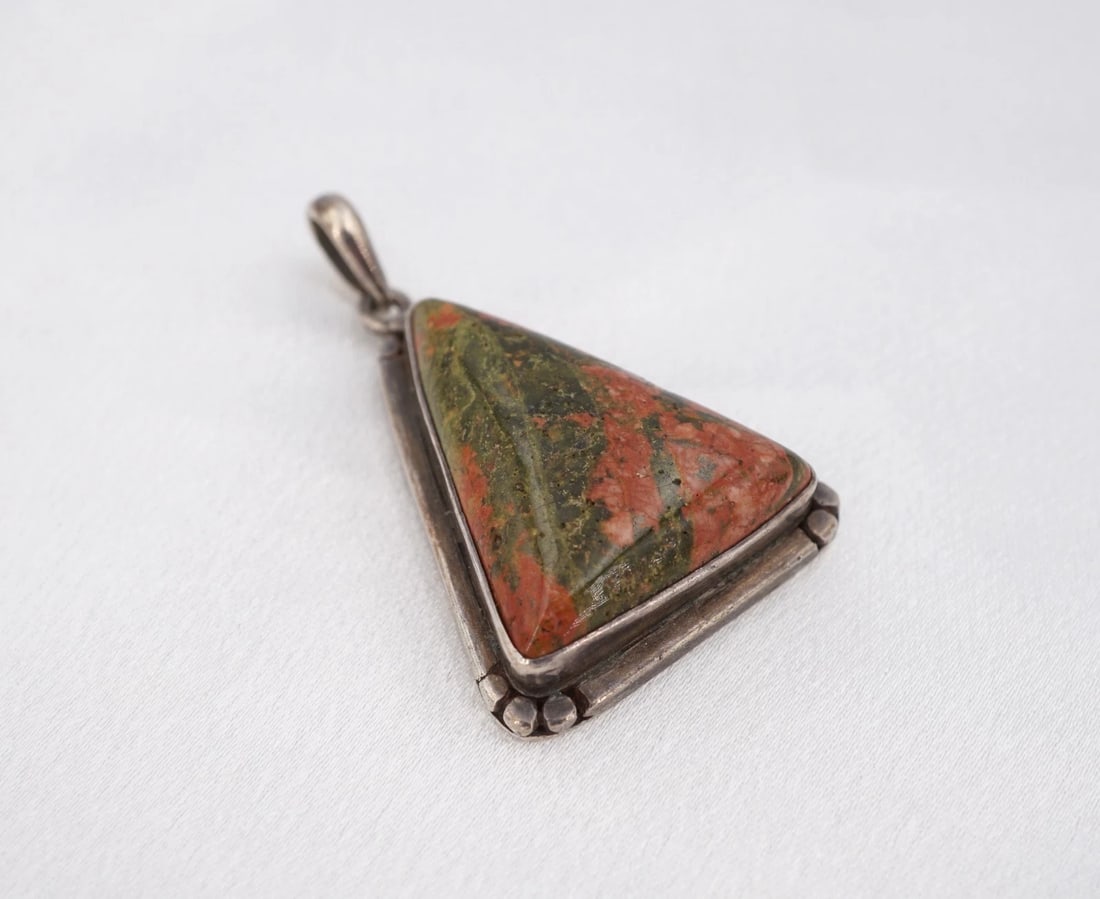 Southwestern Unakite Pendant Triangle Bezel Sterling Silver 1.9" Natural PS2374: This beautiful Southwestern artisan pendant features a large, triangular unakite cabochon bezel set in a chunky sterling silver pendant frame. This gorgeous pendant is perfect for any jewelry collecti