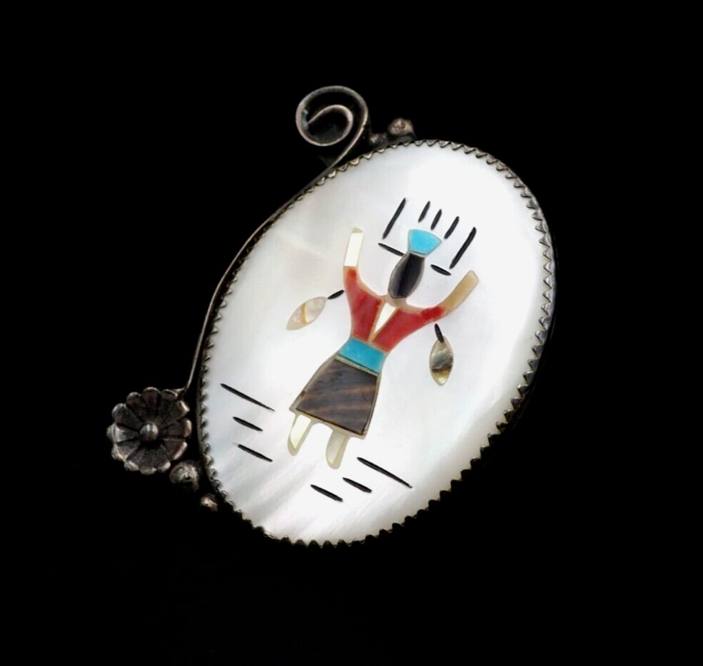 Vintage Navajo Inlay Ring Kachina Multi-Gemstone Long Size 6 Statement RS3650: This vintage Southwestern ring features an intricate depiction of a kachina dancer crafted from inlaid turquoise, coral, mother of pearl, jet and shell set flush in a solid sterling silver band. With 