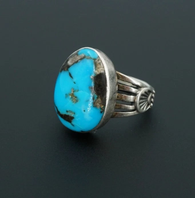 Navajo Turquoise Statement Ring Sterling Silver Size 8 Signed SM RS3887: This beautiful Navajo artisan ring features a gorgeous polished slab of blue turquoise bezel set atop a tapered band with a split shank design. Complete with hand-stamped details, this stunning ring i