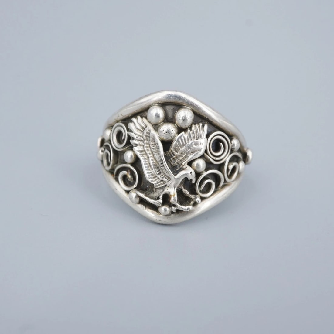 Mens Navajo Eagle Statement Ring Chunky Size 10.5 Artisan Signed Y RS3810: This artisan ring features an intricate 3D eagle design set atop a wide sterling silver band. Complete with ornate swirls and bead accents, this incredible ring is a great addition to any Southwest or